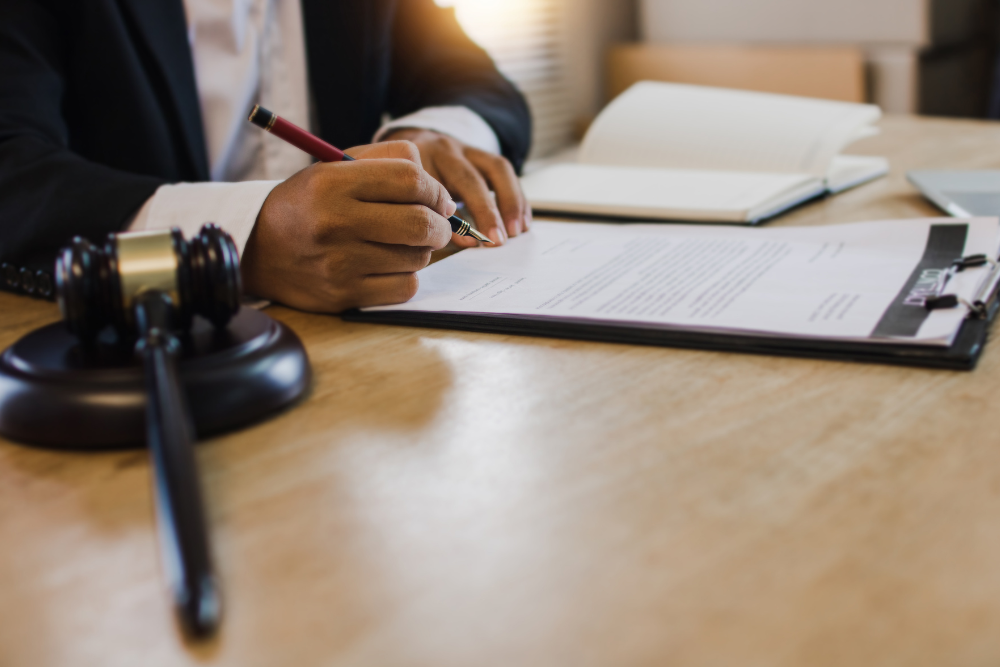 Image of probate attorney signing estate administration documents in Rhode Island